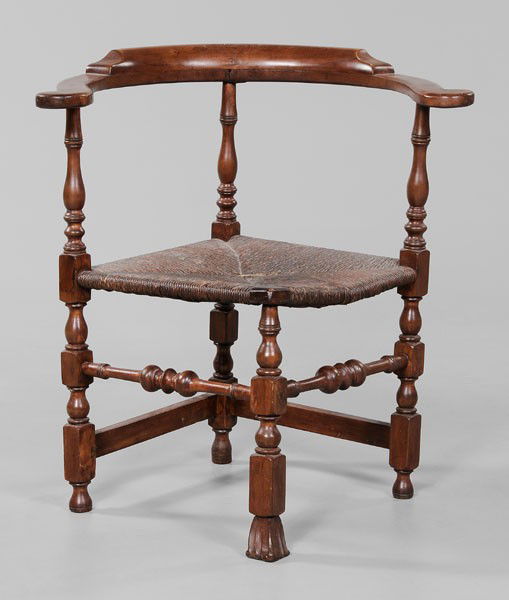 William and Mary Corner Chair: New England, 18th century, maple, birch and other mixed woods, carved Spanish front foot and rush seat, 30-1/2 x 27-1/2 x 24 in., good condition overall, old refinishing, break to one seat rung and on