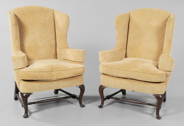 Pair Queen Anne Style Wing Chairs: probably late 19th/early 20th century, in the Boston style, mahogany legs and H stretchers, yellow-upholstered frames and loose cushions, 47 x 35 x 26-1/2 in., minor abrasions to frames, upholstery wi