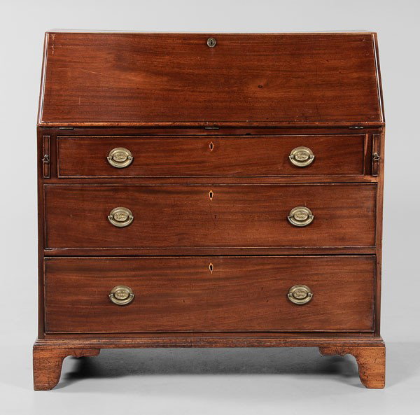 Georgian Mahogany Slant-Front Desk: British, late 18th/early 19th century, figured mahogany with oak, ash, mahogany and other mixed secondary woods, inlaid kite escutcheons and original lion-decorated drawer pulls, fitted interior and o