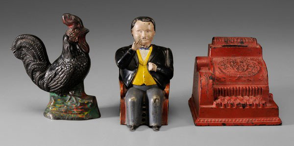 Three Late 19th Century Banks: American: one mechanical, "Tammany Bank", "Hall's patent", dated June 8, 1876, 6 in.; cast iron Crowing Rooster, 6-1/4 in.; "A Penny A Day", gutta percha, 4-1/2 in., [lacking base,] all with original 