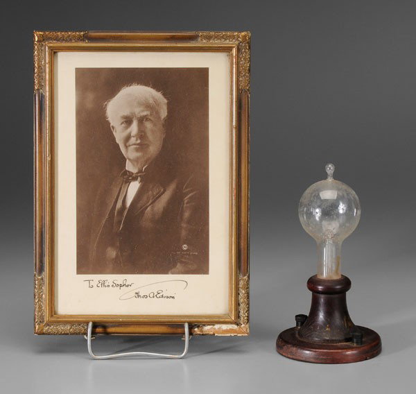 Thomas Edison Signed Photograph,: Light Bulb, (1847-1931, American, inventor of the light bulb), early 20th century, sepia-toned portrait inscribed "To Ellis Sopher, Thos. A. Edison" in black ink, 9-5/8 x 6-3/8 in. (sight); in origina
