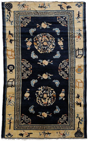 Chinese Rug: early 20th century, blue rectangular panel with bats, flowers and circular medallions, Greek key and floral borders, 4 ft. x 6 ft. 6 in., pile varies from none to medium, areas of wear, small areas la