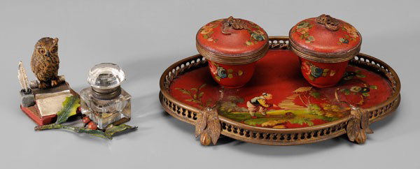 Toleware, Owl Inkstands: Continental, 19th century: one toleware, painted tin and brass, two hinged-lid inkwells with leaf finials, four fig-shaped feet, two glass inserts, 3-3/8 x 8-1/2 in., [minor paint losses, alligatoring