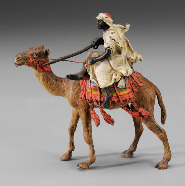 Vienna Bronze Bedouin on Camel: Austrian, early 20th century, cold painted, amphora mark for foundry of Franz Xavier Bergmann (1861-1936), 5-1/8 in., lacking one saddle tassel, scattered paint losses, rifle and front left camel foot