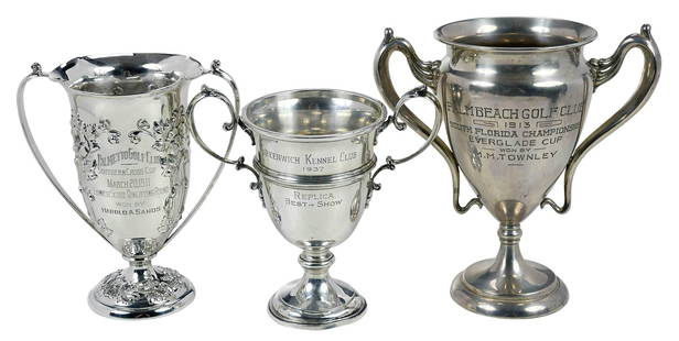 Three Sterling Urn Form Trophies: American, 20th century, including largest with Art Nouveau style handles, "Palm Beach Golf Club/1913/South Florida Championship/Everglade Cup/Son by/M. M. Townley", marks for Simons Brothers Co. (Phil