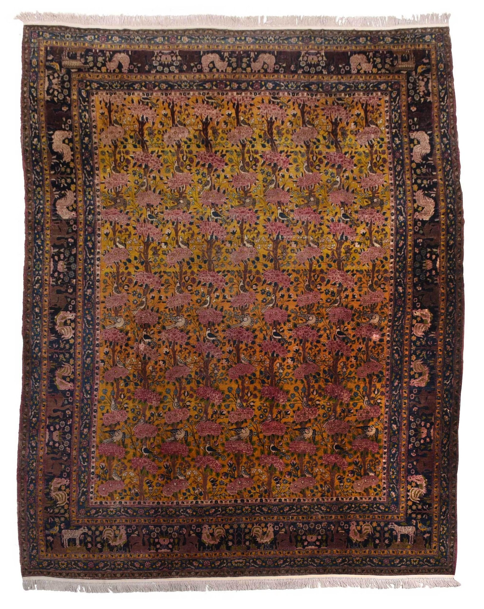 Kerman Tree of Life Carpet: early 20th century, yellow field with flowering tree decoration with resting birds, guard border with camel and rooster decoration, 8 ft. 1 in. x 9 ft. 8 in. Provenance: Property from the John B. Scho
