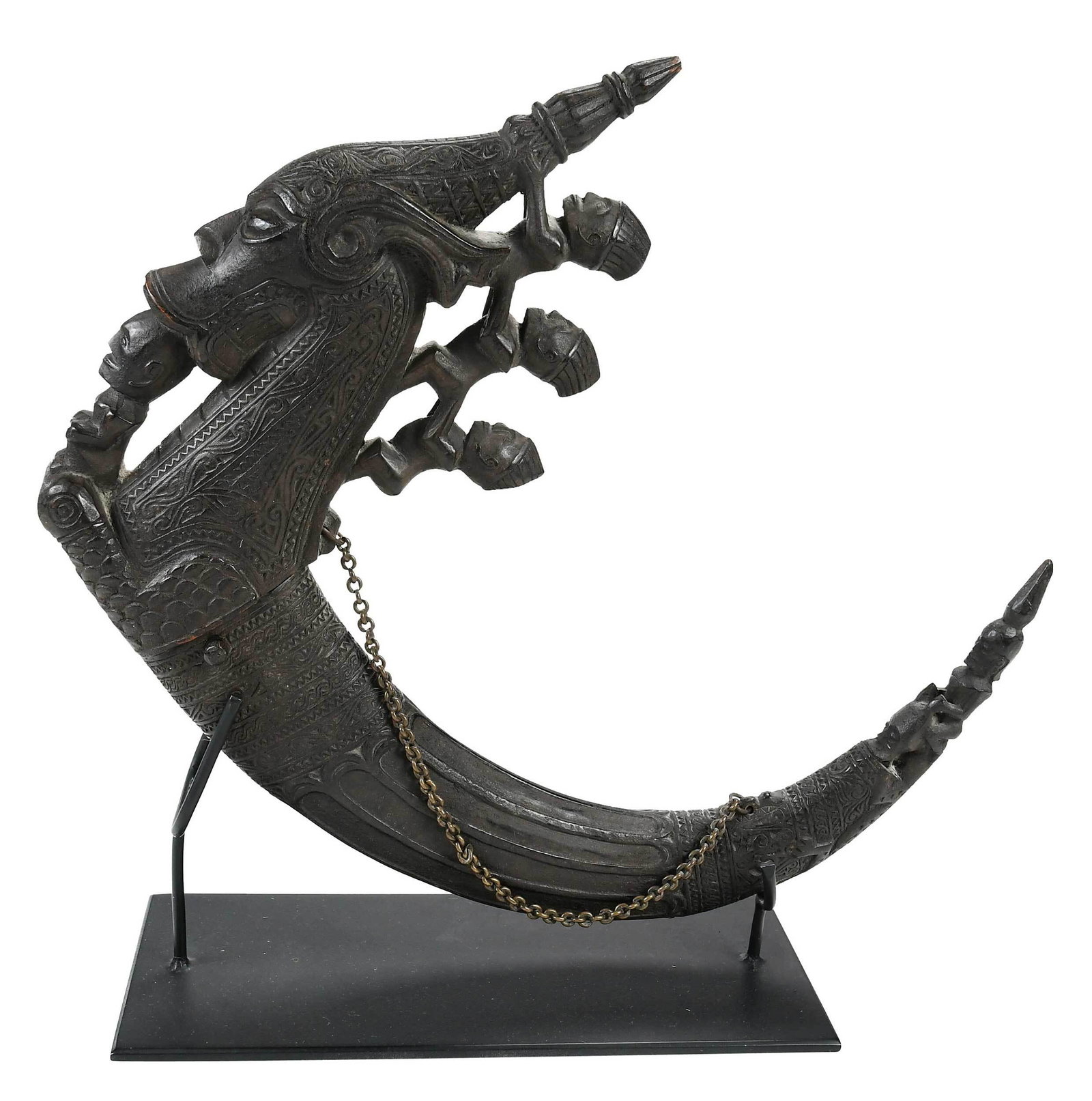 Indonesian Shaman's Wooden and Horn Magic Container: Batak purse for carrying shamanic potions and mixtures, painted black with metal chain, carved intricate geometric patterns and figures, 14-1/4 x 18 in. Note: Acquired by Dr. Grimes in 1984. Provenanc