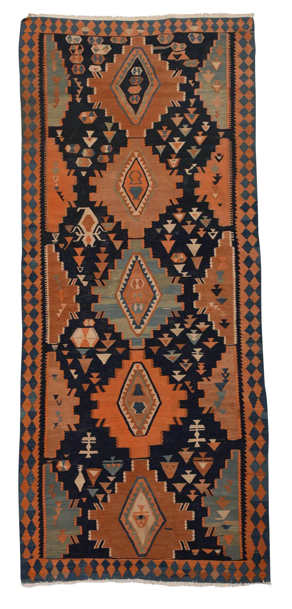 Kilim Runner: 20th century, five stepped medallions on a blue field, 4 ft. 2 in. x 12 ft. Provenance: Property from a Cambridge, Massachusetts Estate