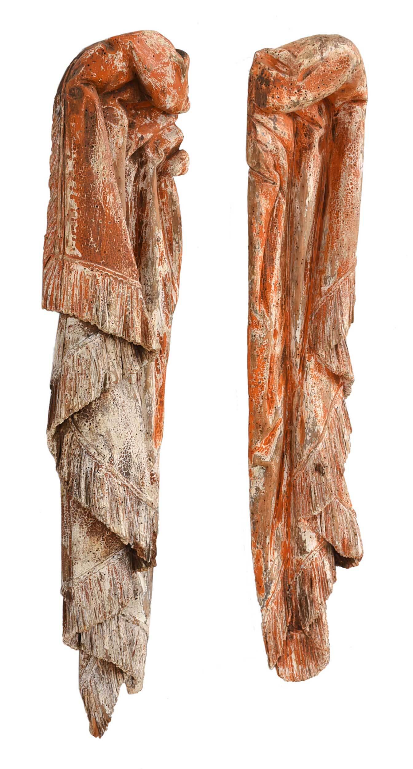 Pair Of Carved And Painted Curtain Form Appliques: Continental, 19th century, two wooden wall sculptures depicting drapery, painted with red and white pigment, both with wire and nail hangers on back, 33-3/4 x 7-1/8 in.; 32-3/4 x 7-1/2 in. Provenance: