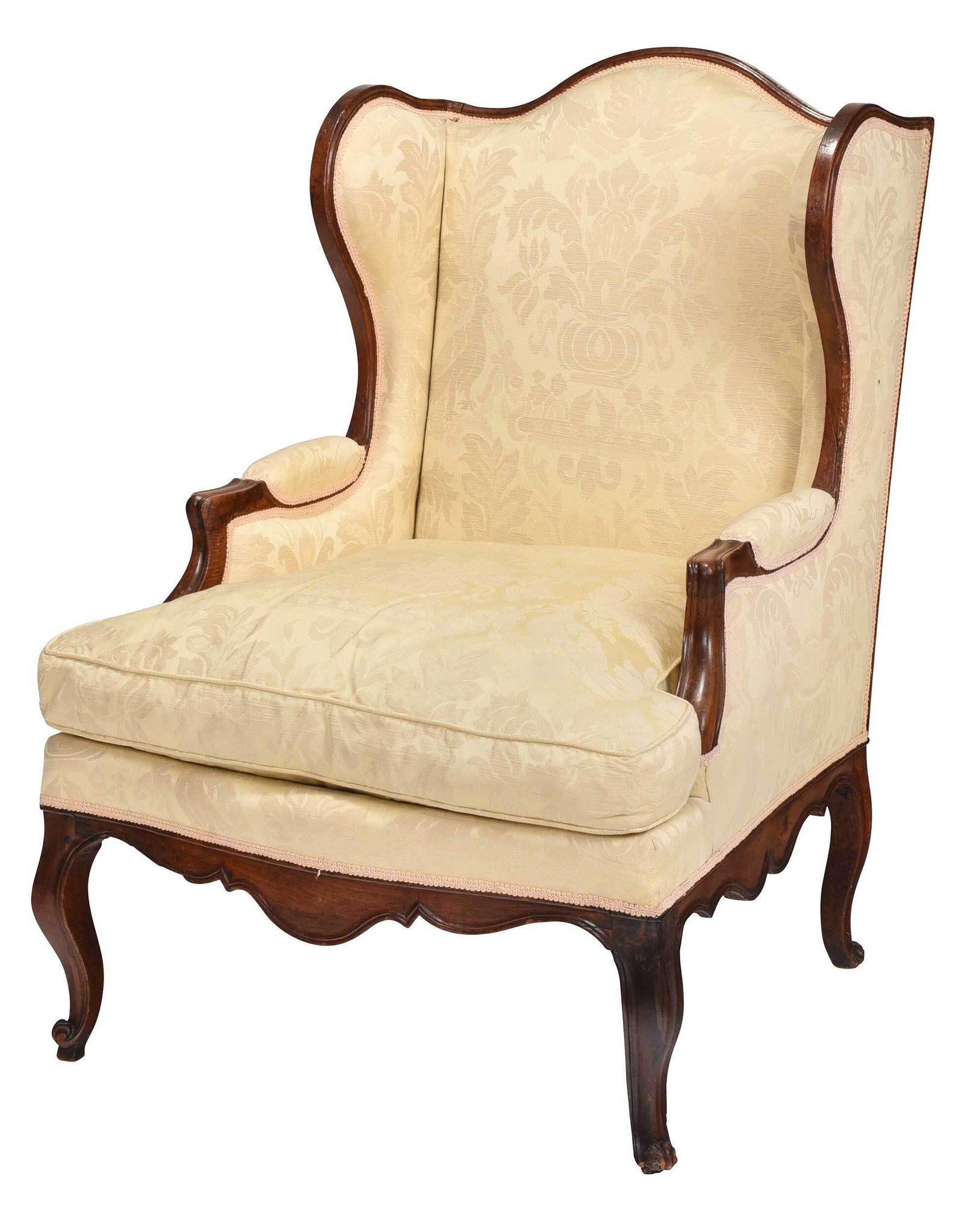 Provincial Louis XV Carved Walnut Bergere: French, 18th century, walnut frame set with yellow damask upholstery with loose down cushion, serpentine skirts, cabriole legs with scrolled feet, 43 x 32 x 28-1/2 in. Provenance: Property from a Camb