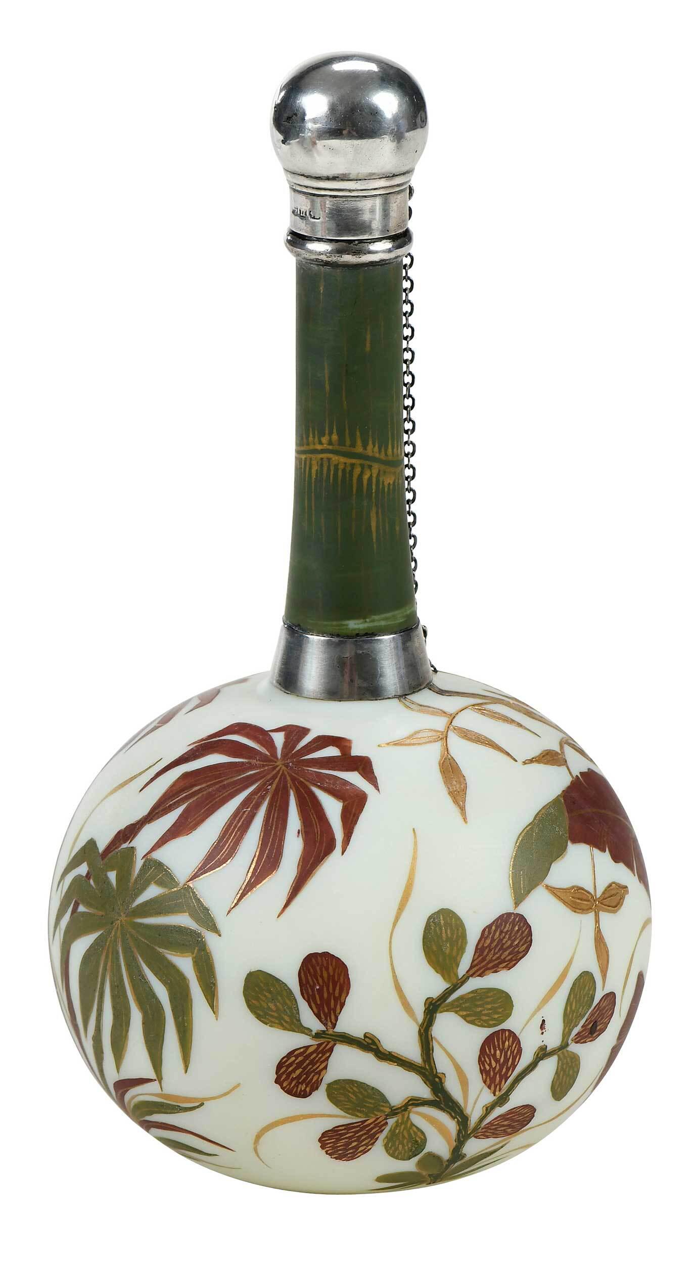 Thomas Webb Satin Glass Perfume Bottle: British, late 19th century, of ivory globular form, long neck with bamboo design, decorated with bamboo and leaf decoration, acid stamped to base "Webb", English silver cap on chain, connecting to ban