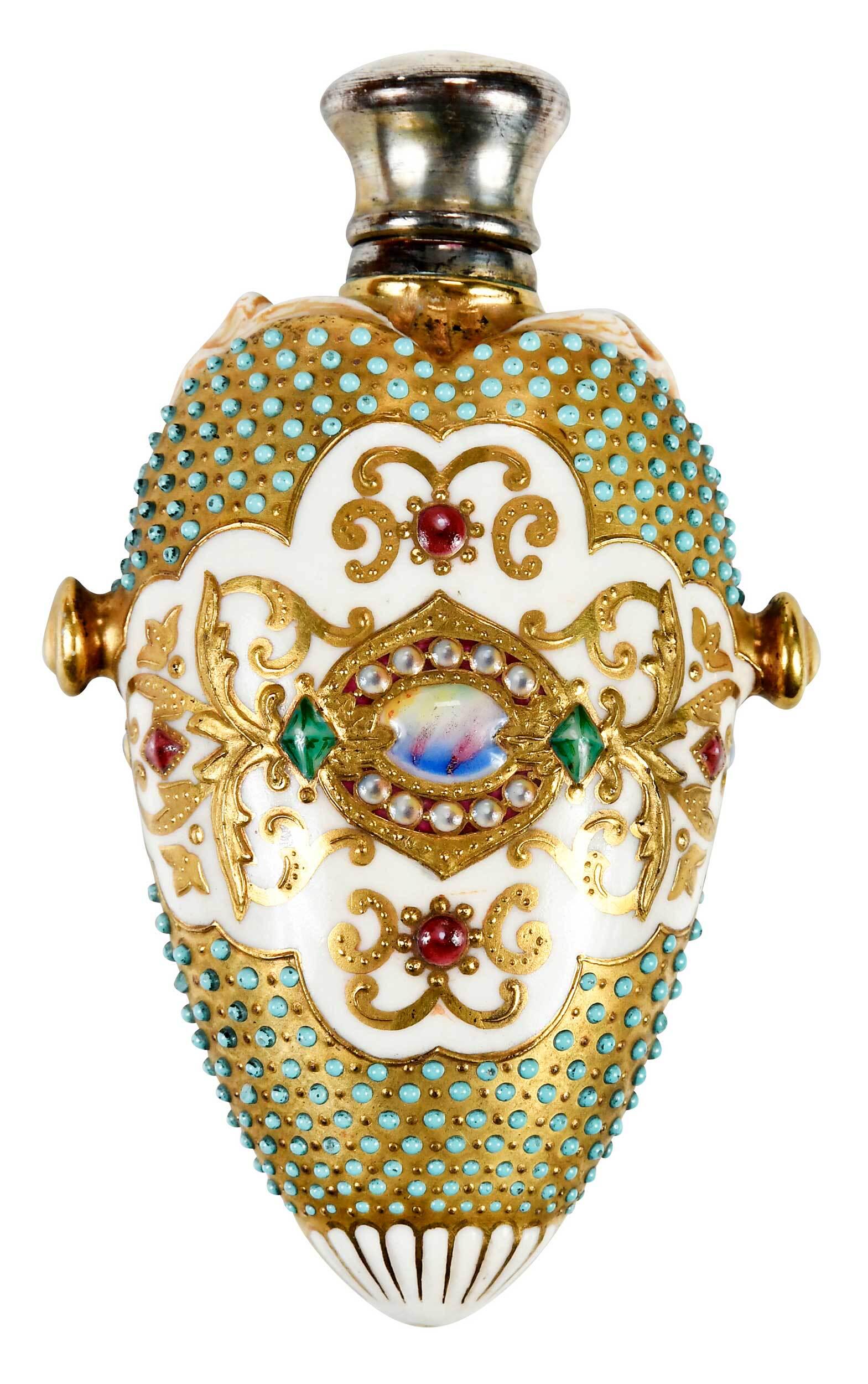 Coalport Porcelain Scent Bottle: British, late 19th century, of teardrop form, having an ivory ground, with gilt, beaded and enameled jewel decoration, circular handle to each side, birds at shoulders, hinged silver plate cap, 4-1/4 