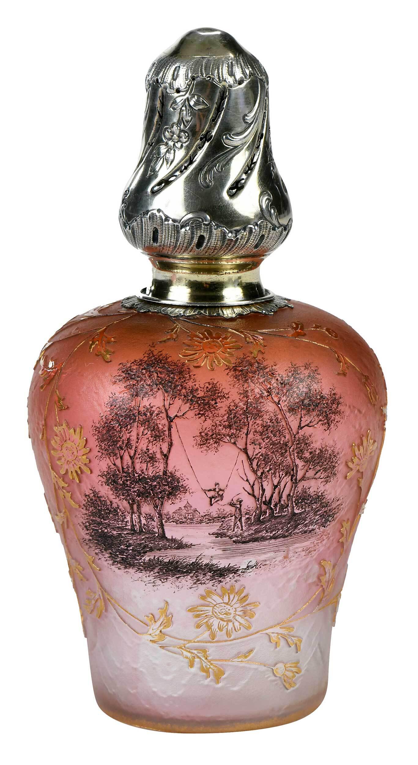 Daum Nancy Cameo Glass Perfume Burner: French, circa 1900, rose lavender iridescent glass, textured, gilt cameo floral motif frames a charming scene in cameo grisaille, depicting a young maiden in a swing assisted by her swain, signed on b