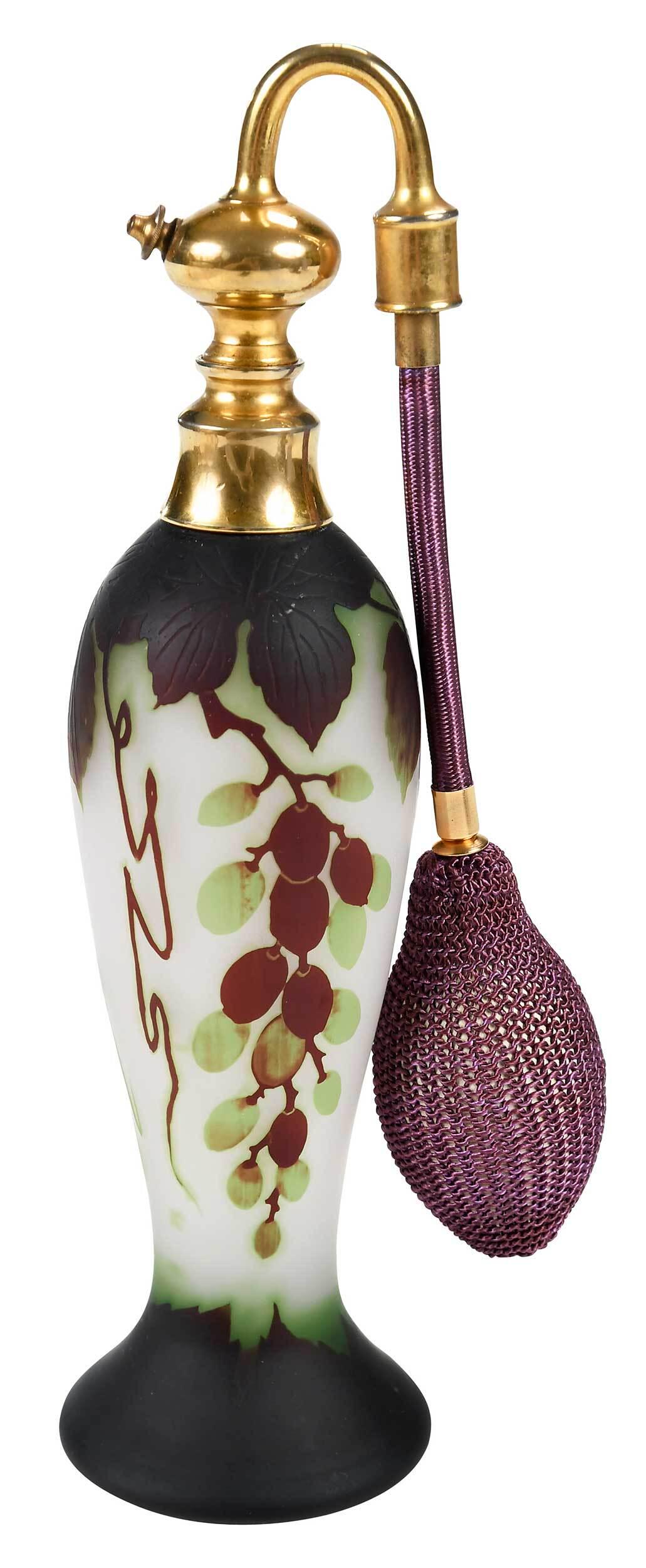 Georges Raspiller Cameo Glass Atomizer: French, early 20th century, of baluster form, burgundy cut to green cut, to white ground, grapes and leaves decoration, signed G. Raspiller in cameo, gold tone hardware, 8-1/4 in. Provenance: Collecti