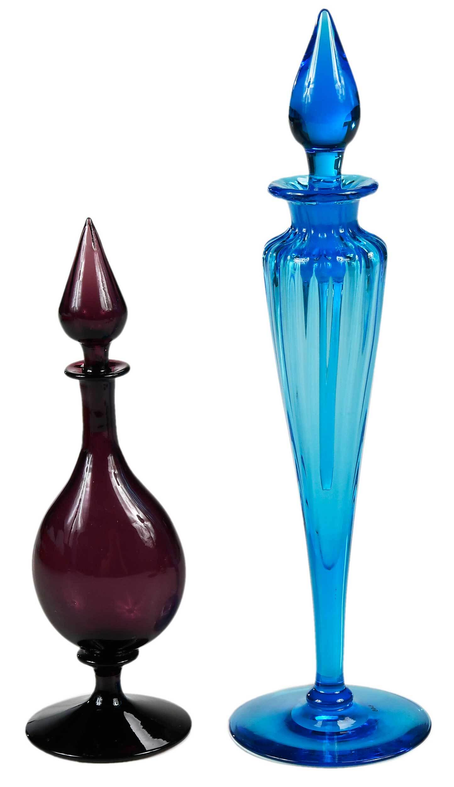 Two Steuben Glass Perfume Bottles: American, early 20th century, shape 1414, of tapering ribbed form, celeste blue optic glass, flame form stopper, long dauber, circular foot, acid stamped to base "Steuben", 10 in.; of flattened bottle