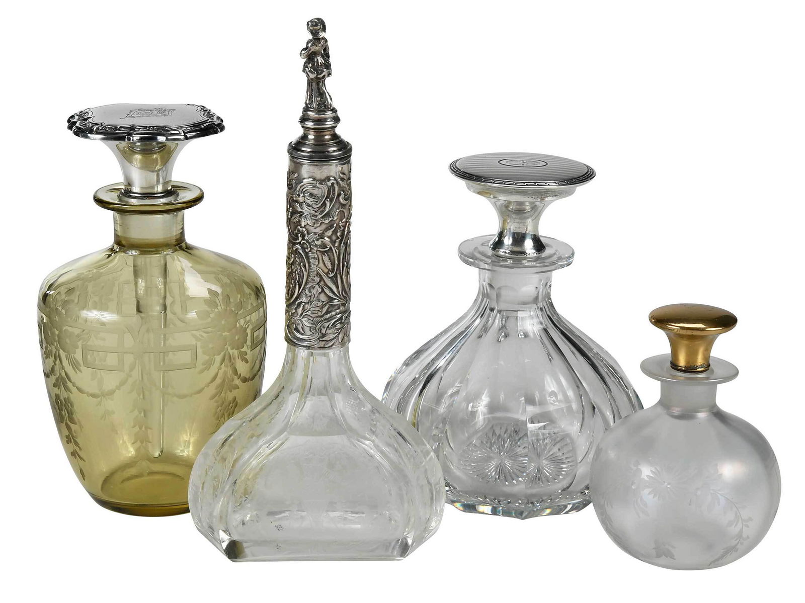 Four Cut and Etched Glass Perfumes, Three Sterling Tops: 19th/20th century, Steuben Verre de Soie bottle engraved by Hawkes, engraved with garland & flower and hanging balls, bottle and stopper numbered "21", acid mark on base "Hawkes", gilt sterling stoppe