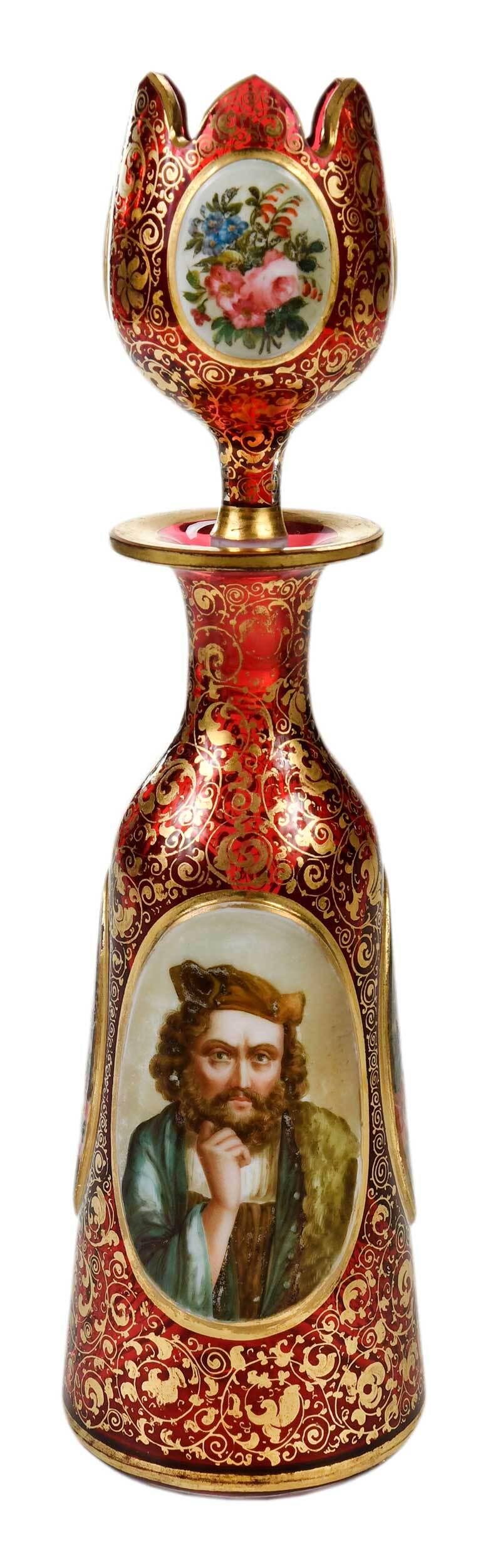 Bohemian Enameled and Gilt Glass Perfume Bottle: mid to late 19th century, of bottle form, having three oval medallions hand painted with flowers, garden with obelisk, and portrait of a gentleman, red ground with scrolling gilt decoration, tulip for