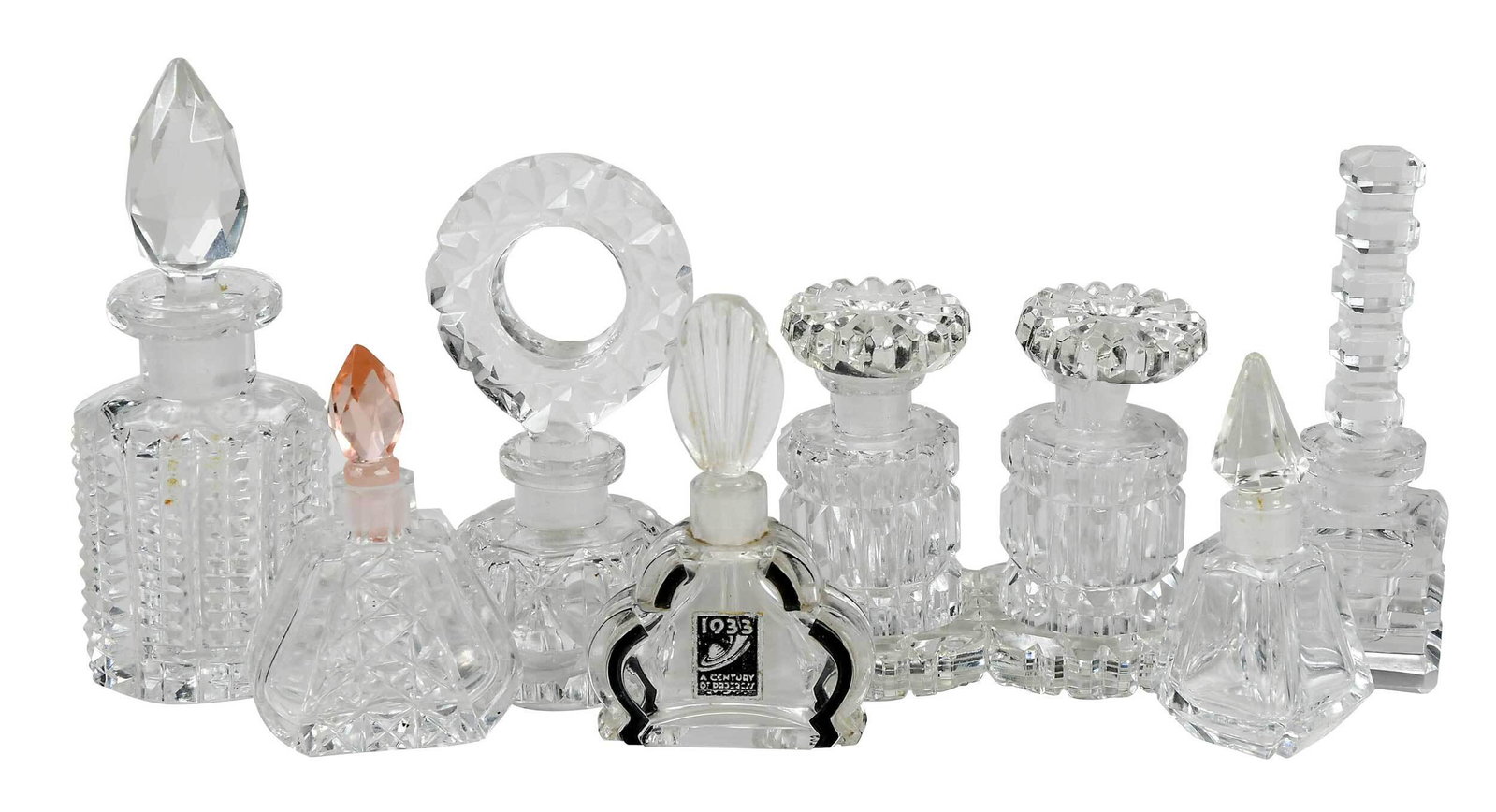 Seven Mini Czech Cut Glass Perfumes: early 20th century, comprising: rectangular faceted form, arrow form stopper, acid etched "Made in Czechoslovakia" to base, 2-1/8 in.; pair of perfumes on fitted tray, circular stoppers, one with glas