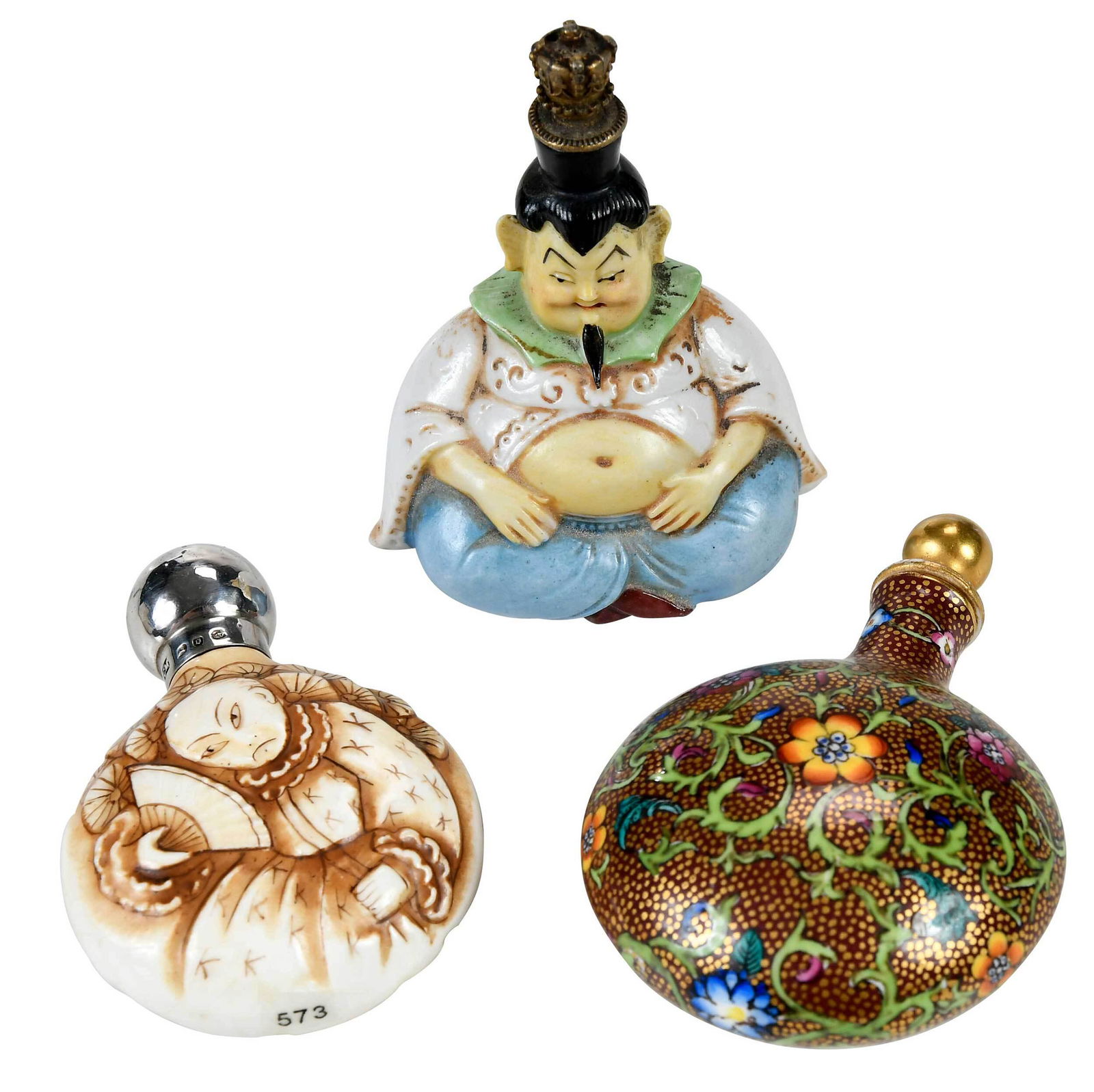 Three Mini Perfumes: 19th/20th century, bottle in the shape of a seated figure in green collared white shirt and blue pants, with metal crown cap, fine painting of details, back marked "1709", 2-7/8 in.; possibly Coalport