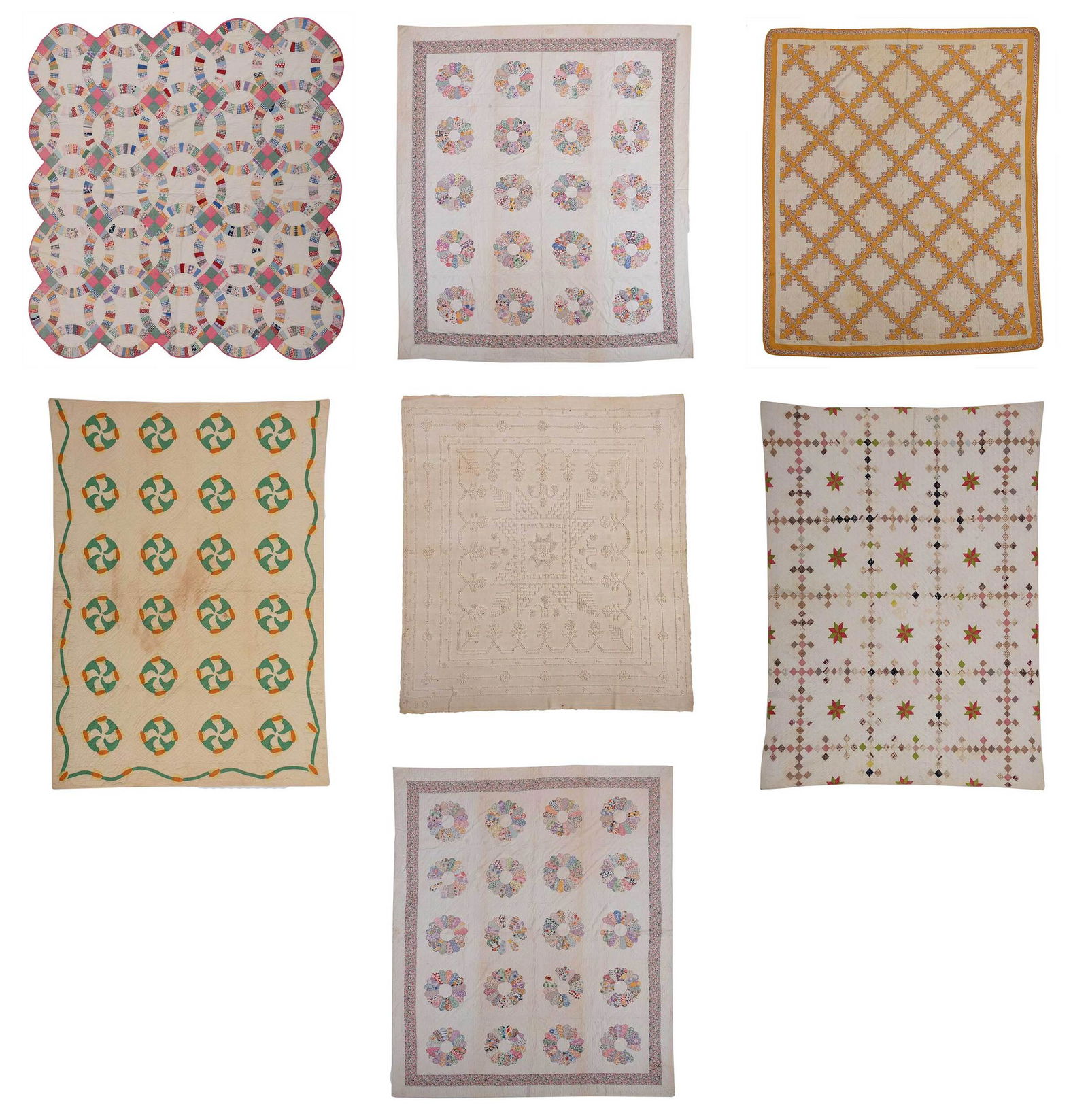 Group of Seven American Quilted Textiles: American, 19th/early 20th century, comprising: two Dresden plate quilts, two ninepatch quilts, pinwheel quilt, double wedding ring quilt, whitework coverlet; largest 97-3/4 x 81-1/2 in. Provenance: Pr