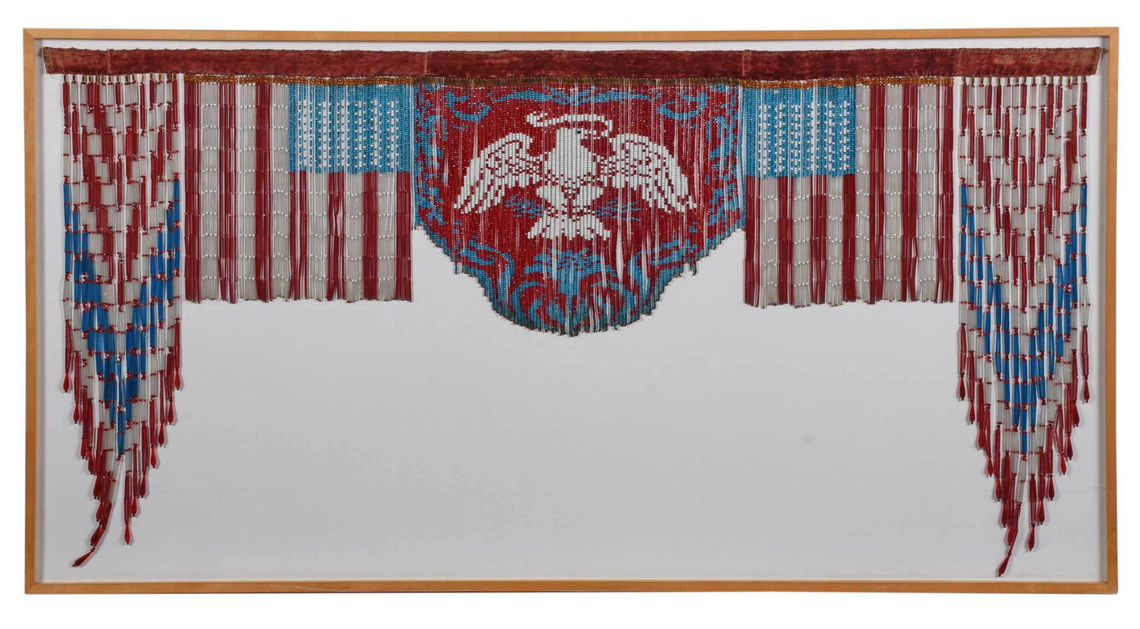 Early 20th Century Beaded Political Banner: American, velvet hanging strip with red, white, and blue beadwork tassels with eagle design, approximately 38-1/2 x 78 in.; wood frame, 43-1/4 x 81-1/4 in. Provenance: Property sold to benefit the Ame