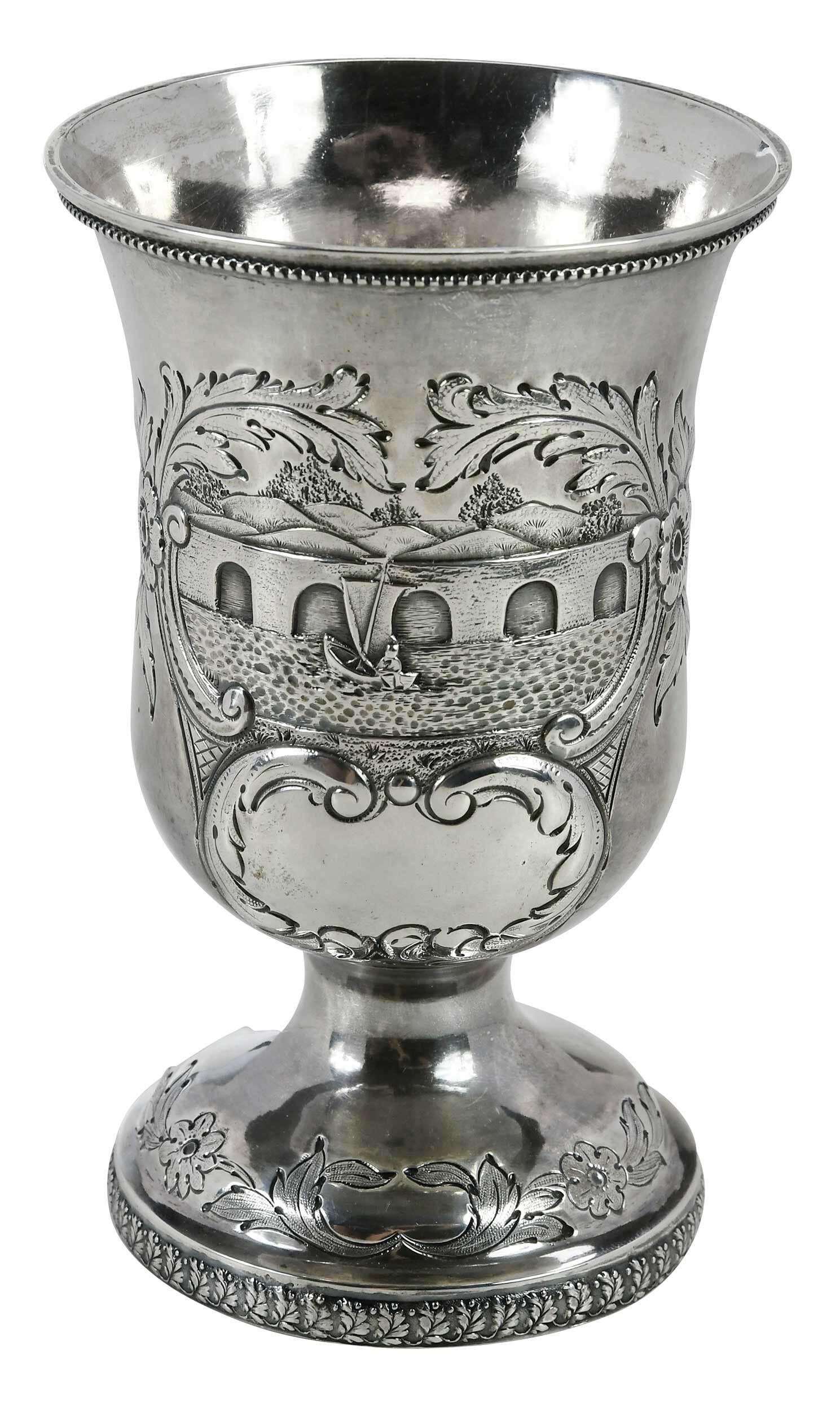 New Orleans Coin Silver Goblet, Hyde and Goodrich: Louisiana, early/mid 19th century, urn form, bead border, decorated with sailboat on water with bridge in background, base with foliate die rolled border, no monogram, marks for Hyde & Goodrich (New O