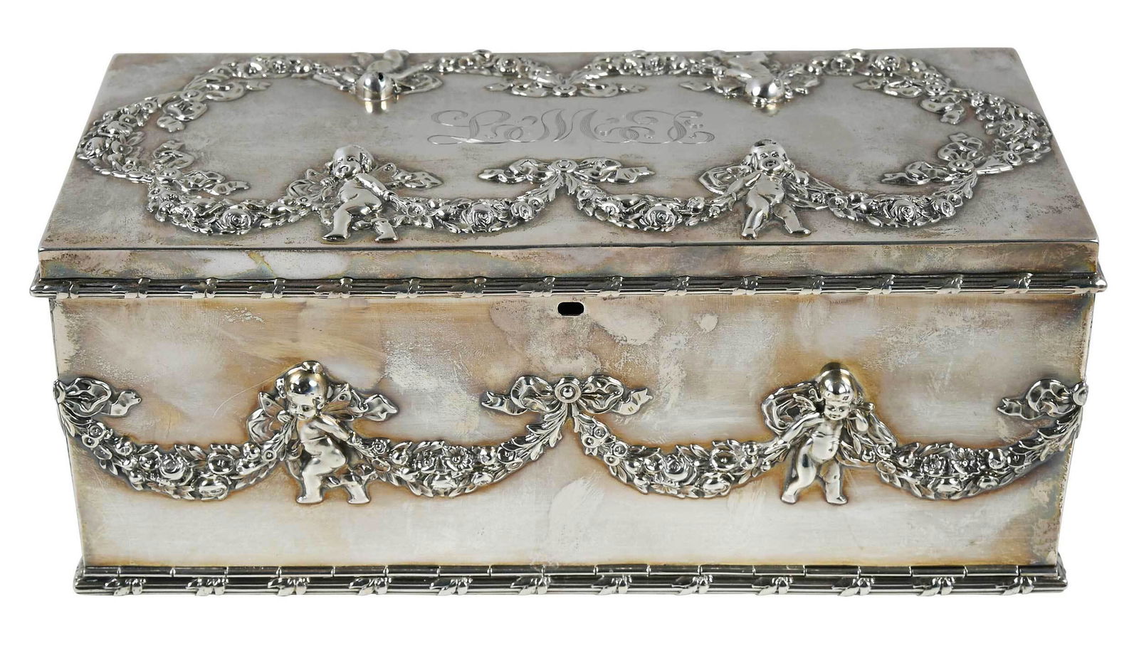Durgin Sterling Jewel Casket: American, 20th century, rectangular with swag and cupid decoration, reed and ribbon borders, lock, monograms, marks for Durgin, "1809", 37.57 oz. T., 4 x 9-1/2 x 4-1/2 in. Provenance: Collection of th
