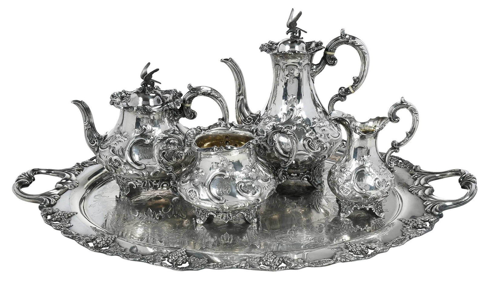 English Silver Tea Service, Silver Plate Tray: London, 1856-1857, scroll and foliate decoration, bird finial, ivory spacers, one side with heraldic device belt cartouche and sheep, some gilt interiors, one side with three letter monogram, maker Wi