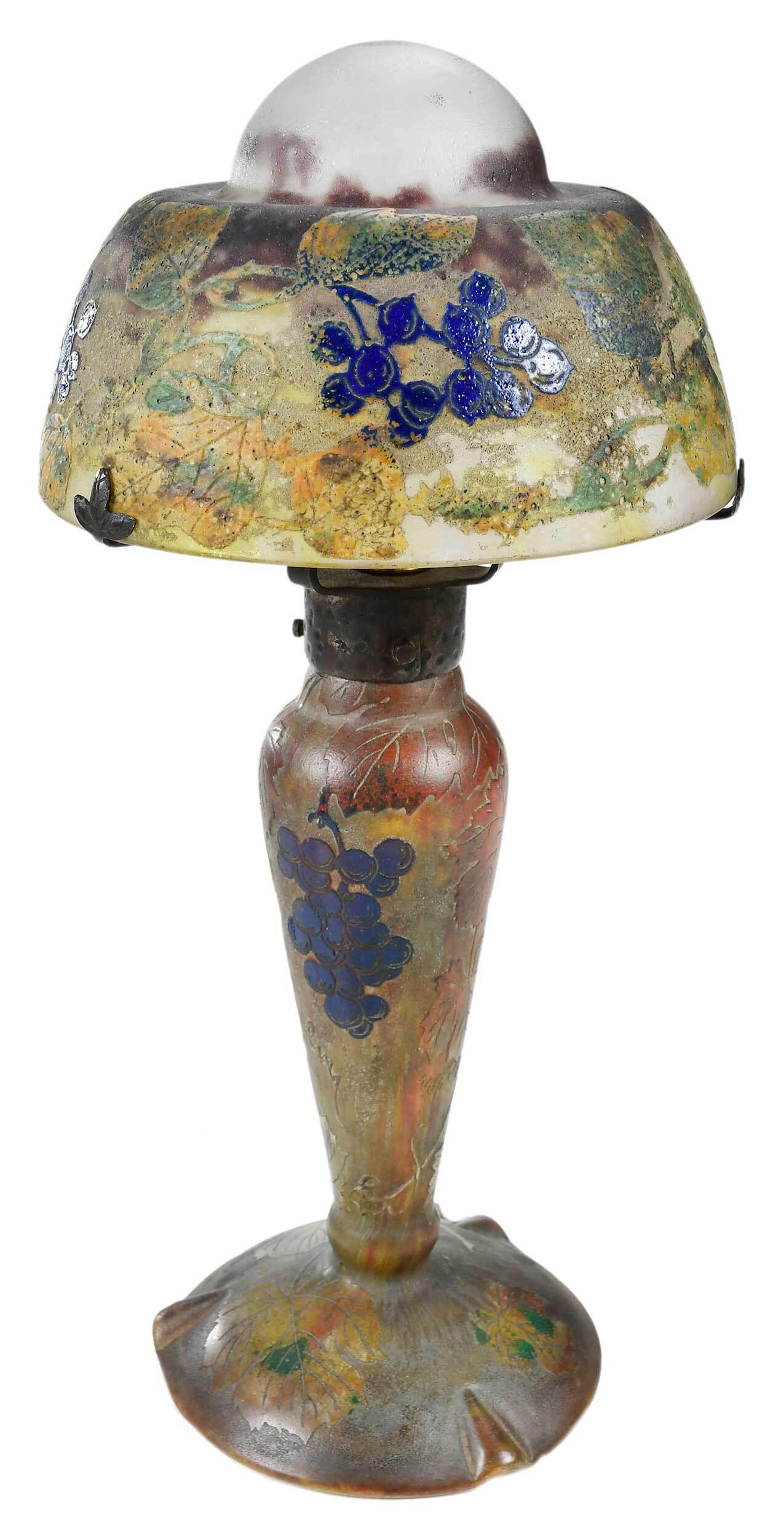 Daum Nancy Glass Table Lamp: French, early 20th century, acid etched cameo glass with twisting grapevines and leaves to domed shade and base, signed in cameo on shade "Daum Nancy" with cross of Lorraine, 16-1/2 in. Provenance: Pr