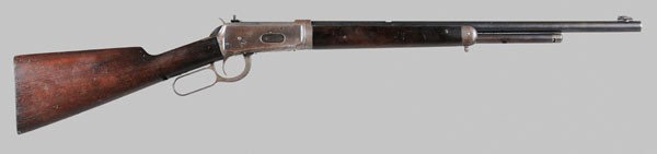 Winchester Model 1894 Rifle: American, late 19th century, 26 in. barrel, half magazine, .32 WS, serial number 145028, (1898), take-down type with Lyman rear peep sight, shotgun style butt plate, no permit required, very good cond