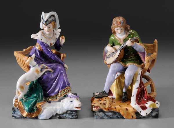 Pair Renaissance Style Porcelain: Figures, German, late 19th/early 20th century, seated young nobleman and noblewoman, in stylized 15th century dress, she seated on a polar bear rug, he on a leopard rug and playing a mandolin, 7 in. a