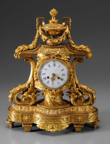Louis XVI Style Shelf Clock: French, early 19th century, elaborate gilt bronze decoration, urn pediment with floral festoons, grapes and acanthus leaves throughout, porcelain face marked "Paris/12 Rue Des Filles du Calviare", gil