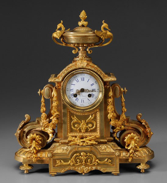 Louis XVI Style Shelf Clock: French, made by Japy Frères, mid 19th century, gilt bronze, urn with dragon handles above circular case, porcelain face marked "Ad. Foucart/…Bouvier Bruxelles" (retailer), time and strike, 17 x 15 