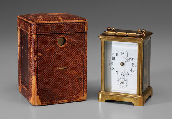 Bailey, Banks & Biddle Carriage Clock: early 20th century, brass case, French works, enameled dial and second hand, open escapement at top, 5-3/4 x 3 x 2-3/4 in., in fitted leather case with key, glass panel at top of clock case cracked wi