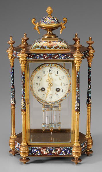 French Champleve Shelf Clock: late 19th/early 20th century, hexagonal brass and glass paneled frame with urn and artichoke finial, Japy Frères brass works, porcelain face with floral swag decoration and filigree hands, time and s