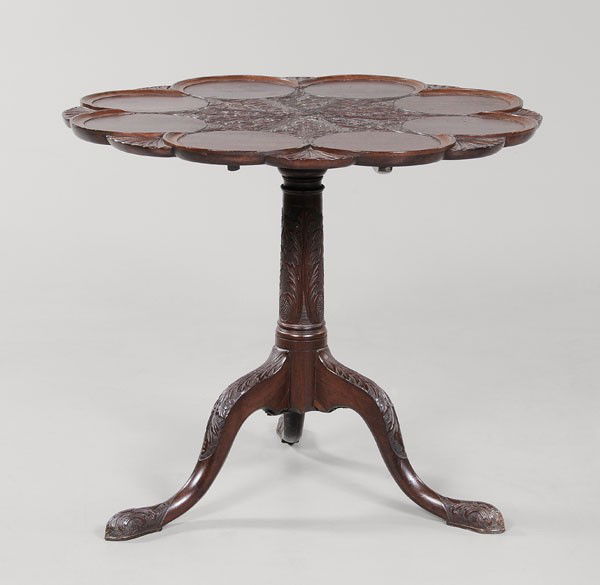 Chippendale Carved Mahogany Tea Table: British, 18th century, leaf-carved tilting top over carved support and tripod base, 29 x 34 x 33-1/4 in., carving of later date, otherwise generally good condition with scattered cracks, separations,