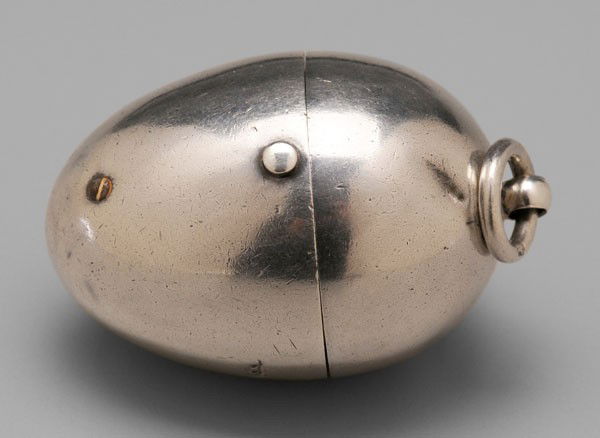 English Silver Sewing Egg: London, 1868, hinged egg-form case with suspension ring and gilt interior thread holder, needle case, unmarked thimble, marks for Henry William Dee, case marked "Cooper/41 St. James's St.", no monogra