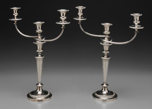Pair Matthew Boulton Sheffield: Plate Candelabra, English, early 19th century: each with three urn-form cups on reeded and twisted arms, gadroon borders, Matthew Boulton marks, no monograms, 19-3/4 x 16-1/4 x 5-1/2 in., one with rep