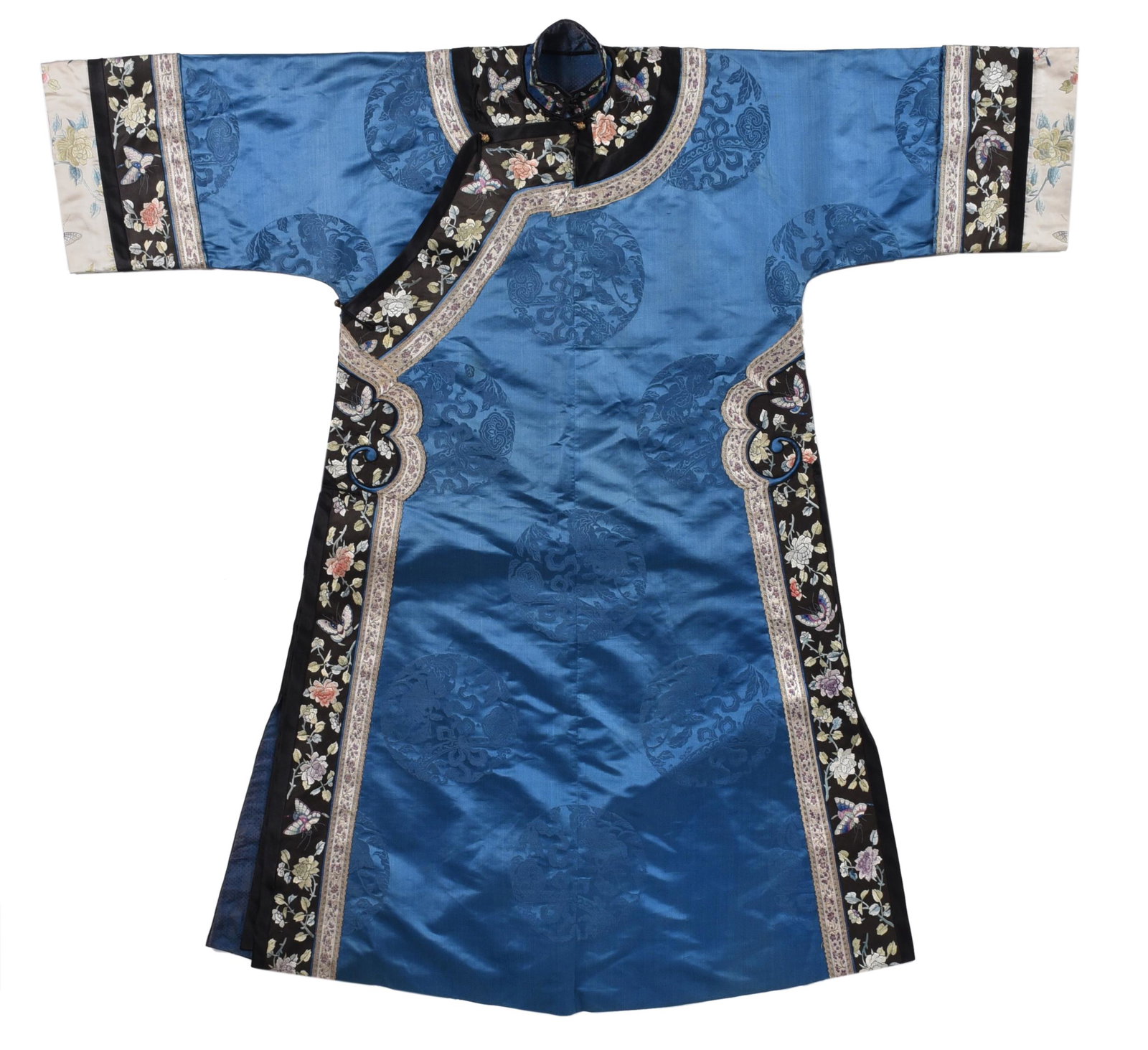 Chinese Silk Court Robe: early 20th century, of cerulean blue shade, having embroidered medallions throughout, decorated with ribbons and silk panels of butterflies, foliate sprays, and Greek borders, one knot closure and one