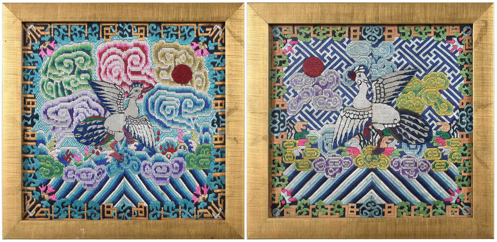 A Near Pair of Chinese Embroidered Civil Rank Badges: 5th civil rank, each depicting silver pheasant amongst scrolling clouds, sun, set in a fitted giltwood frame, badge 8-1/8 x 8-1/2˜in.