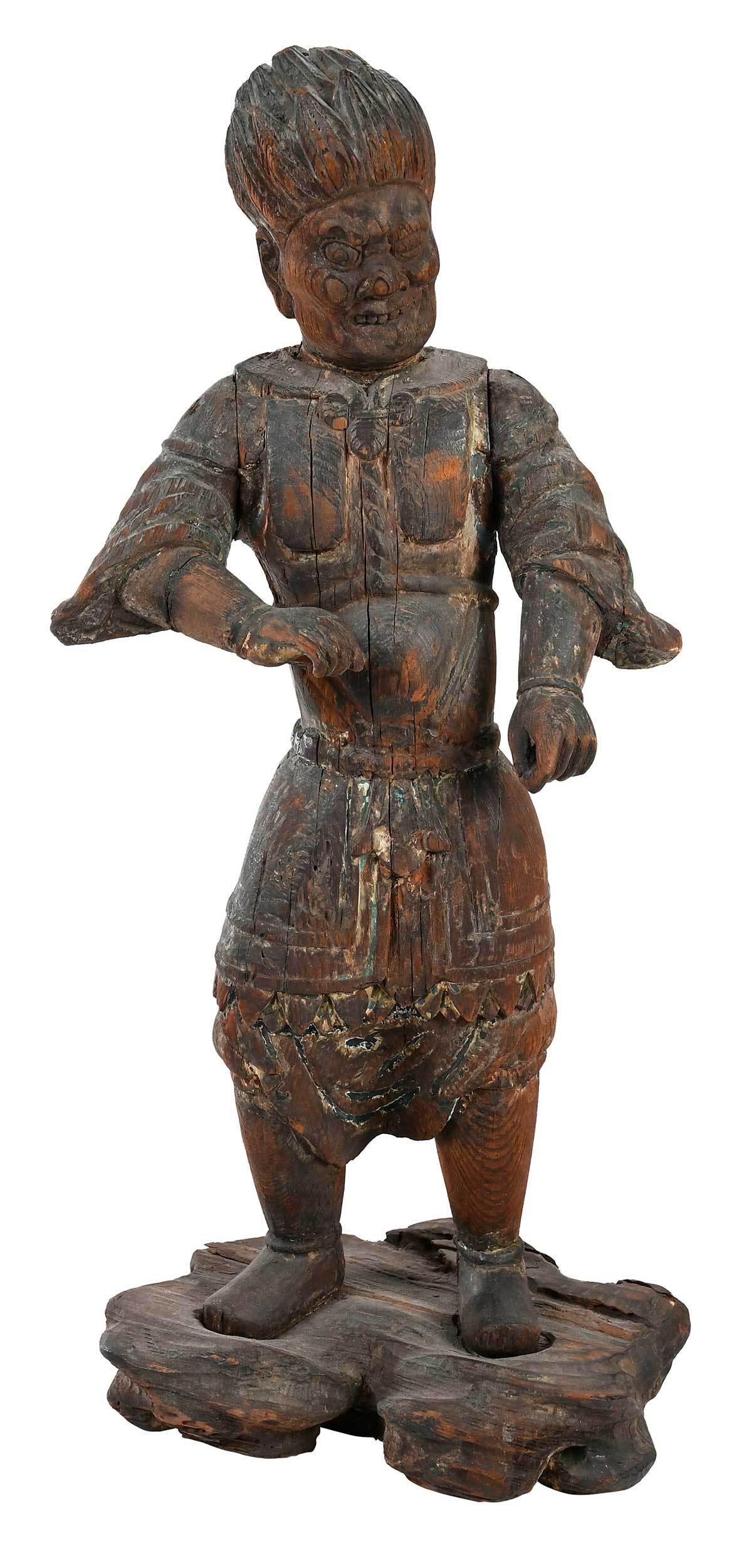 Japanese Carved Wood Demon Figure: possibly Edo period, depicted standing, likely lacking weapon, one eye closed, bearing teeth, in armored dress with boots, standing on a rocky base, remnants of polychrome paint, 21-3/4 in. Provenance