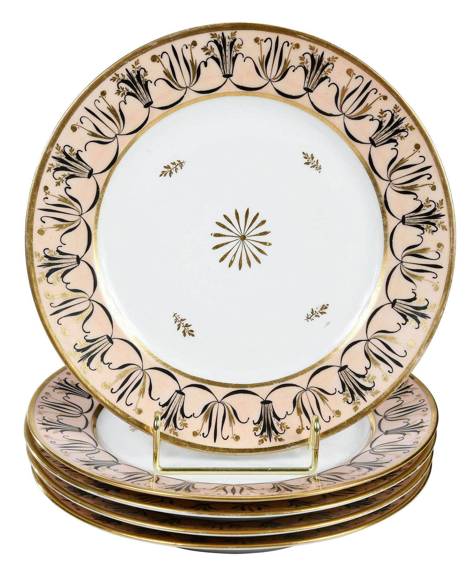 57 Gilt Porcelain Dinner Plates: Continental, 19th century, unmarked, each with a central gilt rosette and scattered foliate sprays, within stylized foliate border with black paint, gilding, and salmon pink ground, 9 in. diameter Pro