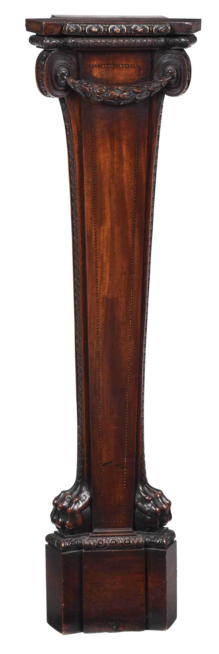 Fine George III Carved Mahogany Pedestal: British, late 18th century, in the Adam taste, with carved molding above a tapered pilaster column with applied garland, carved and scrolled capitals and barber pole inlay, lion's paw feet and carved 