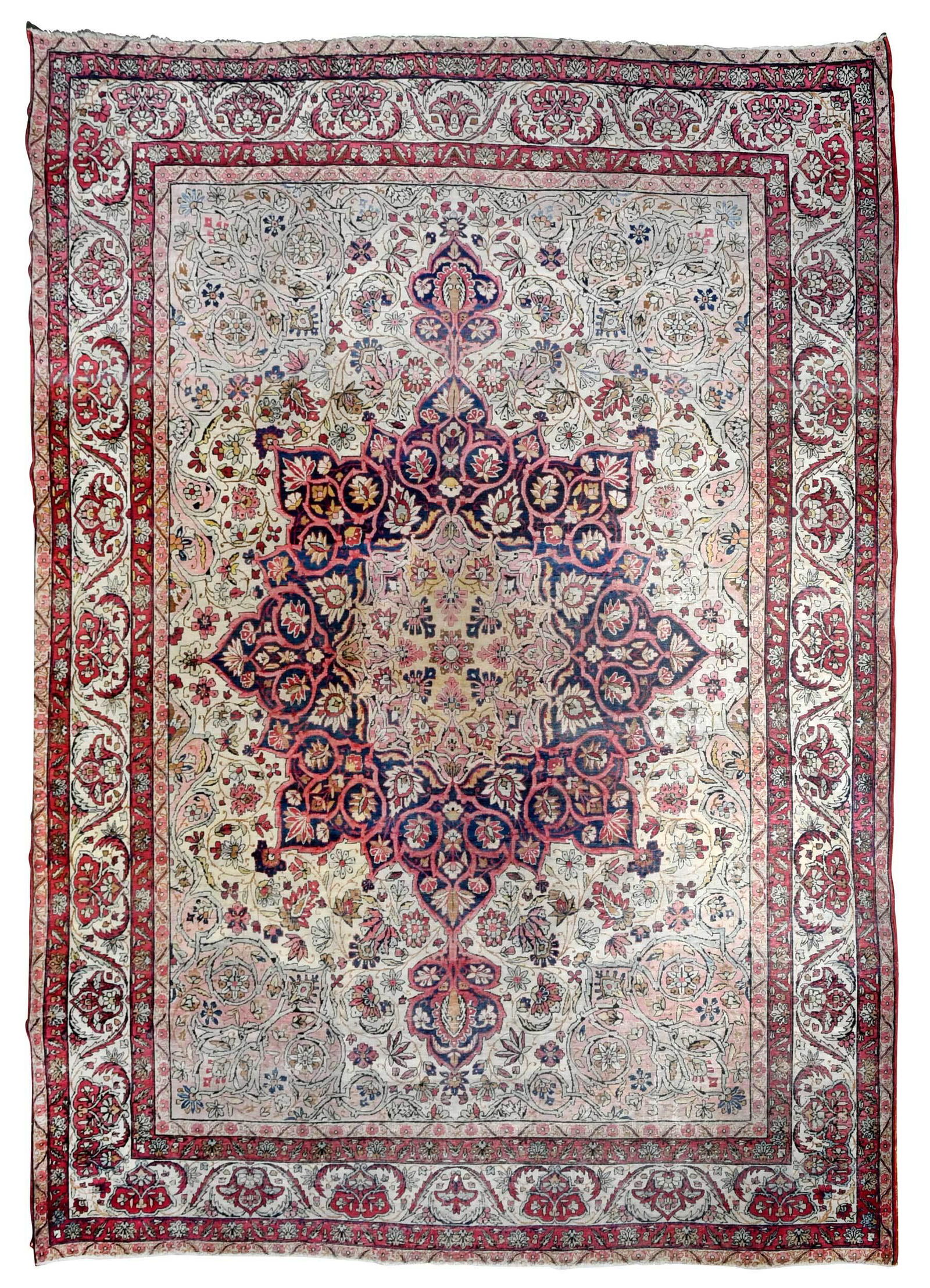 Laver Kerman Carpet: circa 1900, large pedal form medallion on white field with curling vines with blossoms, pink spandrels, white main border with curling leaves and palmettes, 11 ft. 11 in. x 9 ft. 2 in. Provenance: Cla