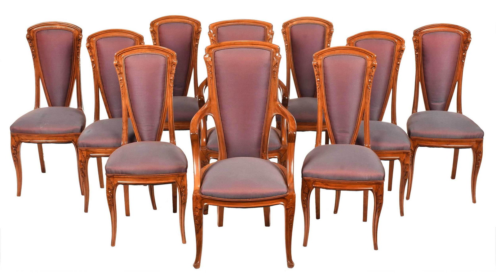 Set Ten Majorelle Art Nouveau "Chicoree" Dining Chairs: French, circa 1900, attributed to Louis Majorelle, each in figured carved walnut frame with leaf decorated legs and rear stiles, two arm and eight side, each with vibrant pearly aubergine upholstery, 