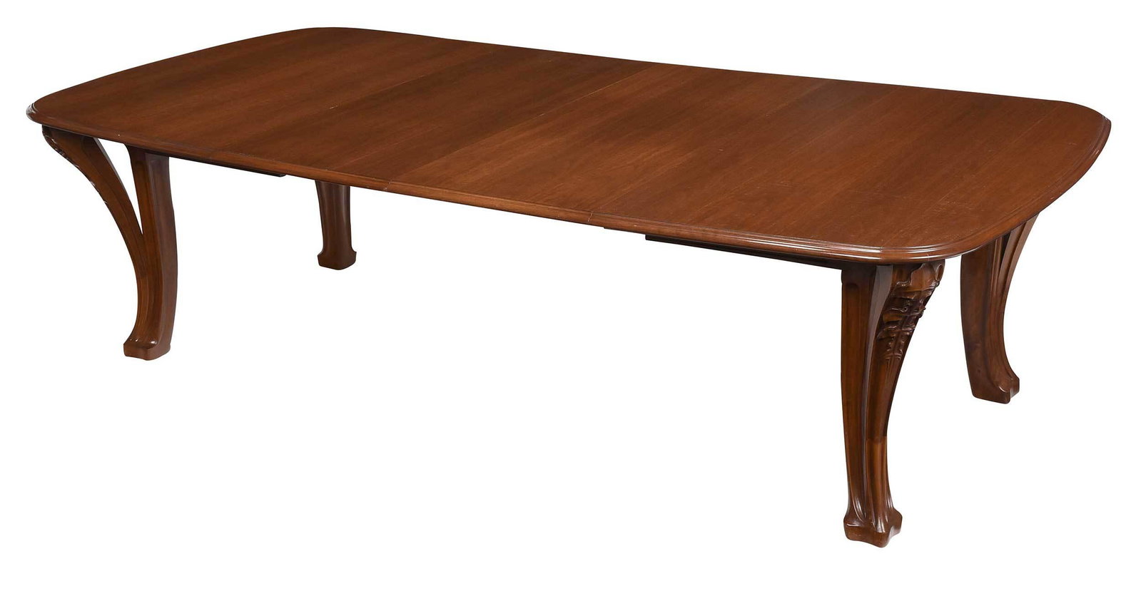 Louis Majorelle Art Nouveau 'Chicoree' Dining Table: French, circa 1900, unsigned, walnut extension dining table with molded top over molded and leaf carved buttressed legs, four leaves, 28 x 50 x 61 in., opens to 141 in. Provenance: Macklowe Gallery & 