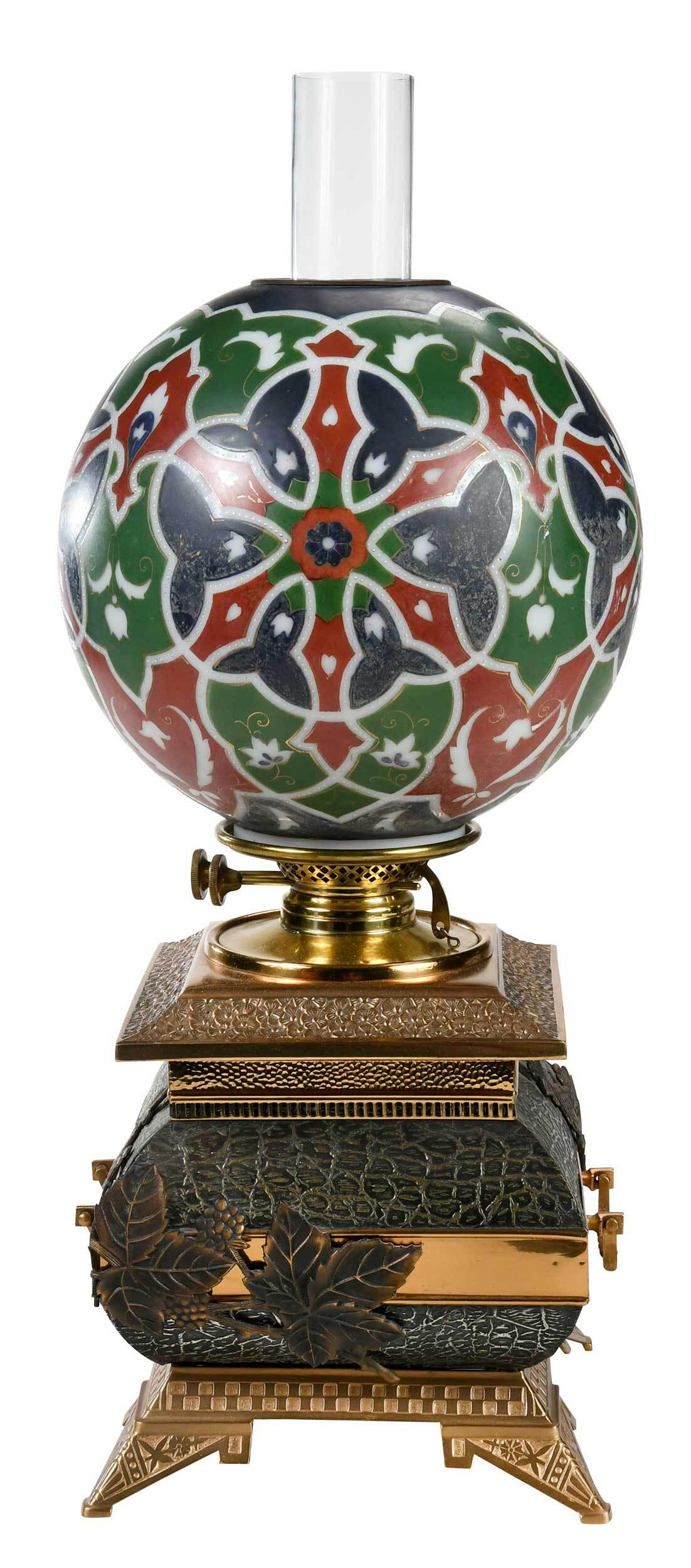 Aesthetic Movement Mixed Metals Oil Lamp with Painted Globe: possibly Meriden, Connecticut, circa 1870s, mixed metal base with multi patterned floral design, with glass chimney, spherical glass shade with paint and gilt Moorish design, possibly William Morris i