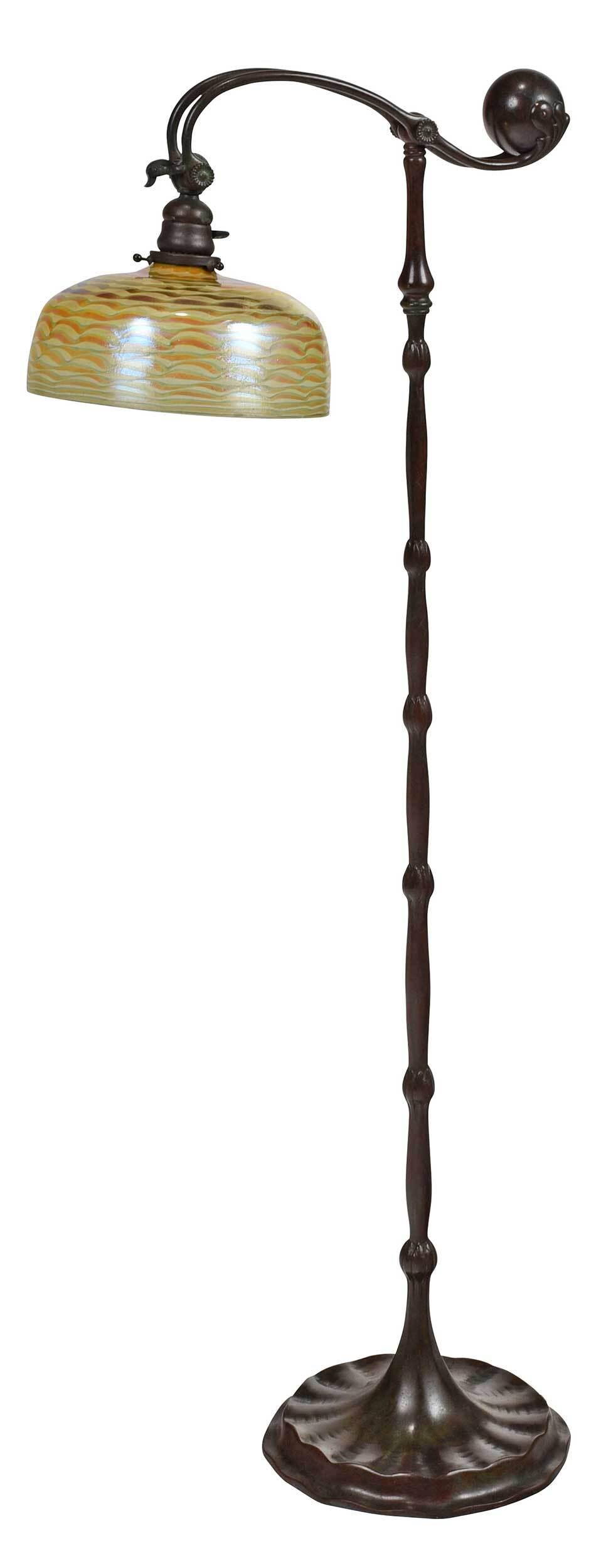 Tiffany Studios Counterbalance Floor Lamp: New York, circa 1910, number 677, single socket, yellow and green Wave pattern shade, marked to inner fitter rim "L.C.T.", patinated bronze base, marked to base "Tiffany Studios/New York/677", 54-1/2 
