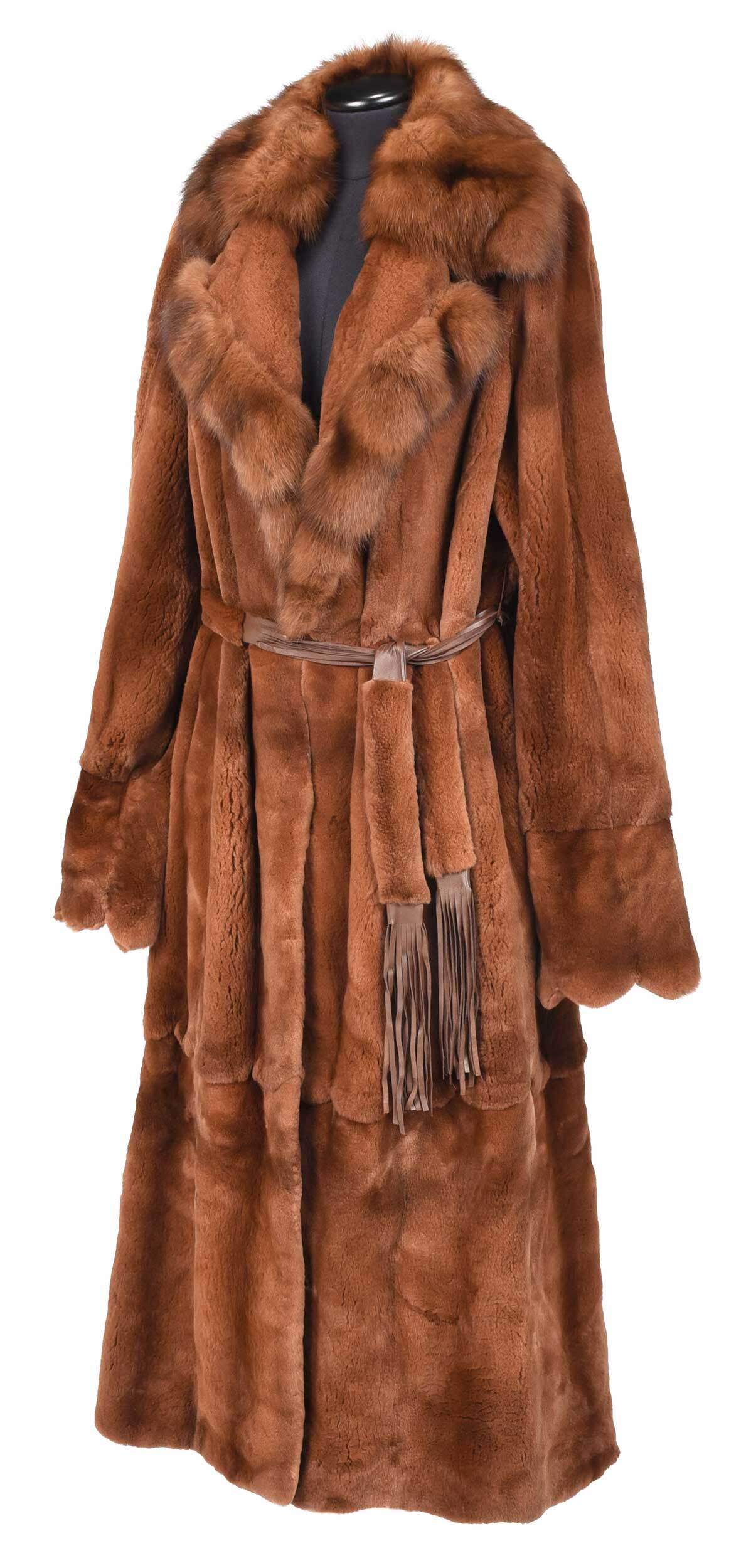 Full Length Mink Shawl Collar Jacket: 20th century, with fur and leather fringe belt, sheared body and natural collar accents, with two rows of petal form flaps, tag reading "York Furs in Buckhead/Atlanta" and stitched monogram "MLN", sho