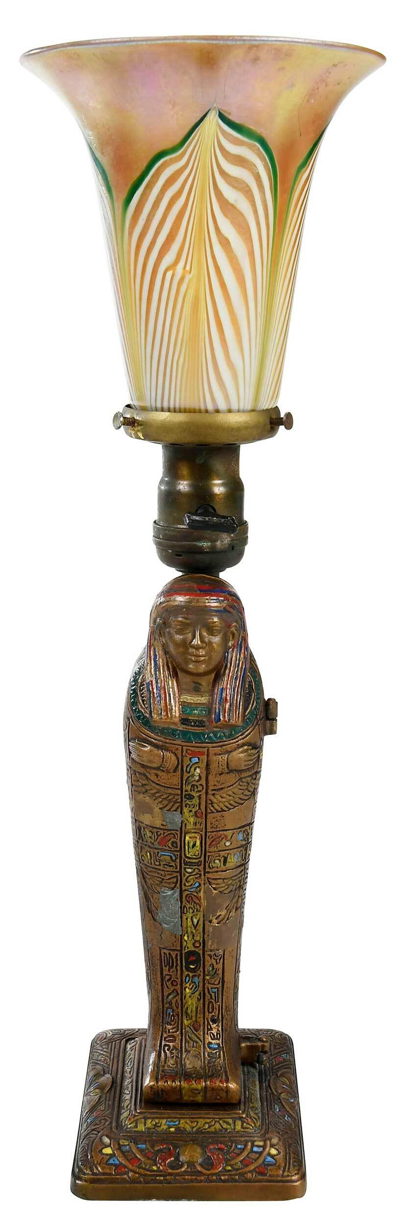 Louis V. Aronson Mummy Bronze Lamp with Steuben Shade: American, circa 1923, Egyptian revival cold painted lamp, sarcophagus opening to reveal gold painted nude, marked "Louis V. Aronson/?/1923", felt lining on base, with yellow glass shade featuring pull